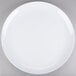 a white plate on a gray background