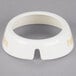 A white circular plastic collar with beige lettering that says "Peppercorn"