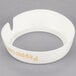 A white plastic collar with beige "Peppercorn" text.