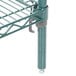 A Metro Super Erecta Metroseal 3 metal shelf with two metal rods.