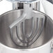 A Hobart mixer with a Hobart aluminum flat beater attachment.