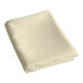 A folded ivory rectangular table cover.