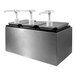 A stainless steel Carlisle condiment dispenser rail with three white pumps.