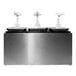 A Carlisle stainless steel condiment dispenser rail with three standard pumps.
