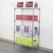 A Metro Super Erecta wire shelf with a green box with black and white text on it.