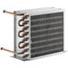 An Avantco condenser coil with copper pipes inside a metal box.