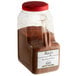A plastic container of Regal Bay Seafood Blend with brown powder inside.
