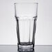 A close up of a clear Anchor Hocking Iced Tea Glass on a white surface.