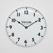 A white Taylor large dial clock with black numbers on it.