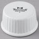 A white Tuxton china fluted ramekin with black text.