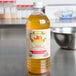 A close up of a bottle of Woeber's Organic Apple Cider Vinegar.