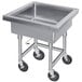 A stainless steel Advance Tabco mobile soak sink with wheels.