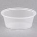 A clear Pactiv oval souffle container with a clear lid.