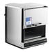 A stainless steel Amana heavy duty commercial microwave with a digital keypad and a pull-down door.