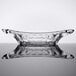a clear glass dish with a curved edge