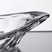 A clear Libbey glass bowl with a curved edge.