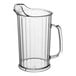 A clear plastic pitcher with a handle.