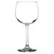 A close-up of a clear Libbey Balloon Wine Glass with a stem.