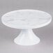 a white pedestal with a white base