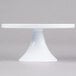 An Elite Global Solutions faux carrara marble cake stand with a white base.