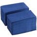 A stack of navy blue paper napkins.