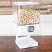 A white Zevro dry food dispenser filled with cereal.