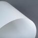 A white translucent Metro shelf inlay sheet with curved edges.