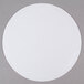 a white circle on a gray surface