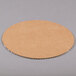 An 18" white corrugated circular cardboard cake surface.