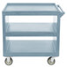 A slate blue plastic cart with wheels.