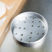 An American Metalcraft aluminum pizza pan with perforations.