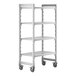 A white plastic Cambro Camshelving Premium mobile shelving unit with 4 shelves and wheels.