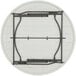 A white round Lifetime plastic folding table on black metal legs.