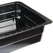 A black melamine food pan with a black rim.