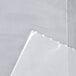 A white plastic LK Packaging food bag on a white surface.