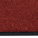 A crimson carpet with a black border.