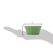 A hand holding a small green floral ramekin.