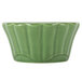 A CAC Festiware green china ramekin with a scalloped edge.