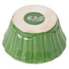 A green and white ceramic bowl with a floral design.