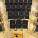 A group of National Public Seating black Melody stack chairs in a room.