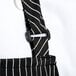 A black and white striped Chef Revival bib apron with a pocket and metal buckle.