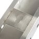 A metal shelf support with a keyhole in it.