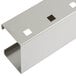 A metal piece with holes on a white surface.