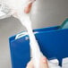 A person using Shurtape to seal a plastic bag.