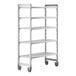 A white metal Cambro Camshelving® Premium mobile shelving unit with four shelves.