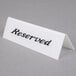 a close up of a reserved sign