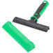 A Unger ErgoTec glass scraper with a green and black handle.