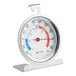 A white round thermometer with red and blue text.