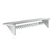 A white metal Regency wall mounted rack with shelf and metal hooks.