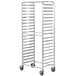 A white metal Regency side load sheet pan rack with wheels.